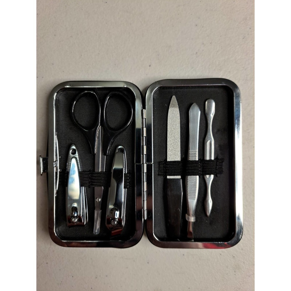 Manicure set travel kit six different tools plus case.